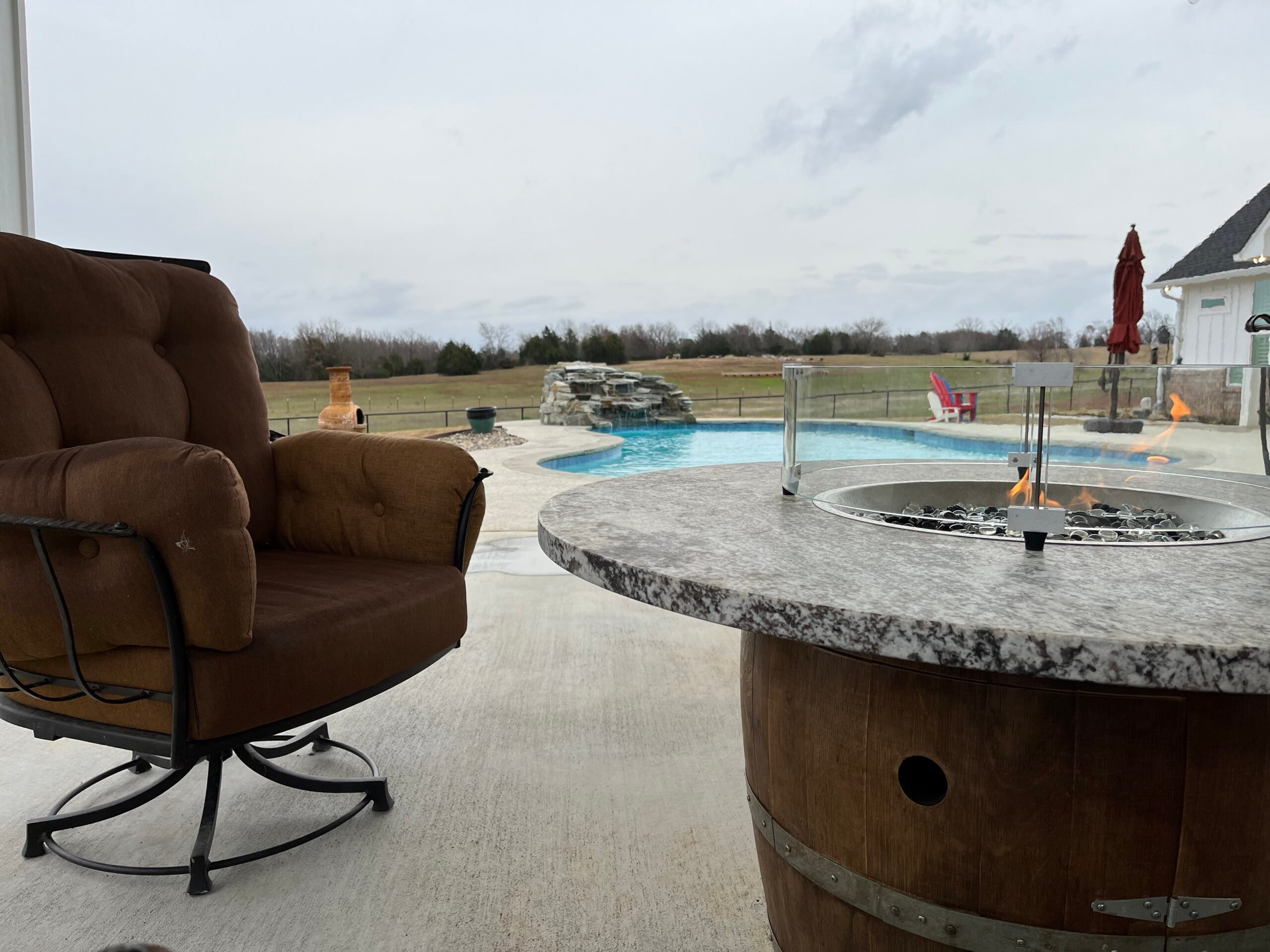 Wine barrel fire table on a patio